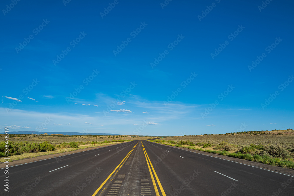 Road panorama on sunny summer day. Highway on travel vacation.