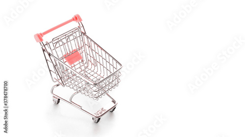 Stainless steel cart. Food shopping basket for retail market. Empty trolley cart for supermarket isolated on white background. Sale buy mall market shop consumer concept. Copy space.
