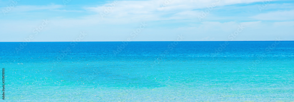 Fototapeta premium Beauty panorama skyline in pure blue azure sea, clear sky background, totally empty sea horizon. For design wallpaper background