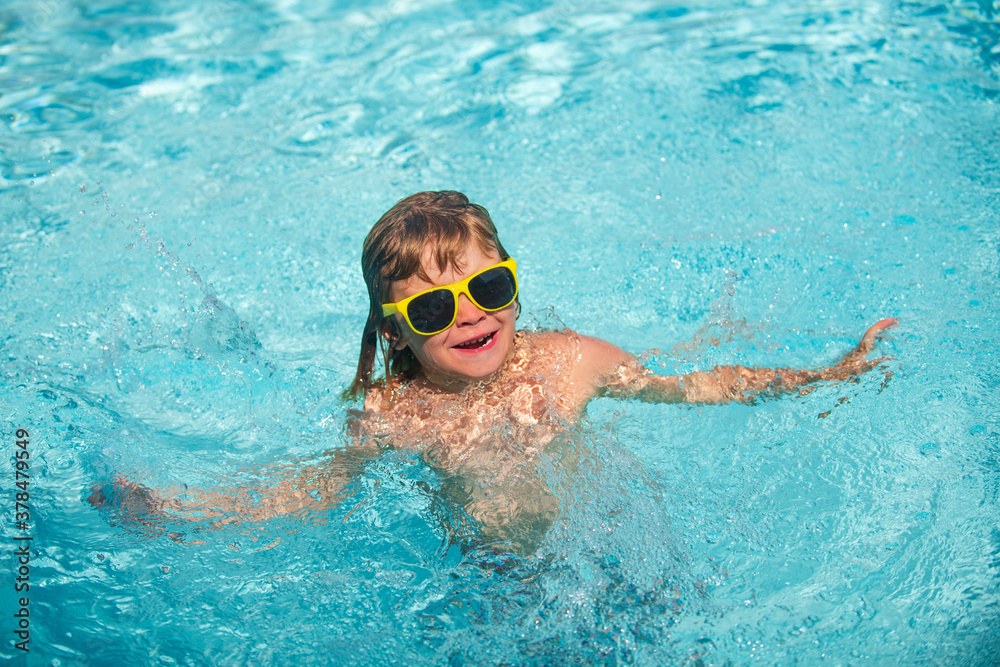 Child swimming in sea or swimming pool.