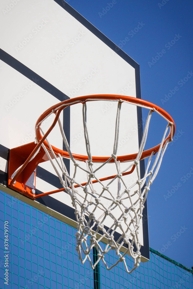 Basketball board with basket hoop on playground. Sport, recreation and healthy lifestyles on fresh air