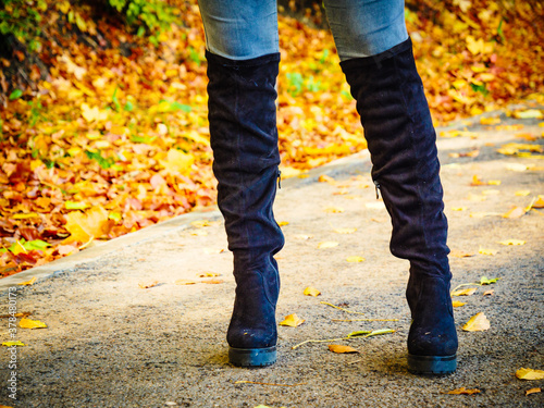 Woman wearing black knee high boots