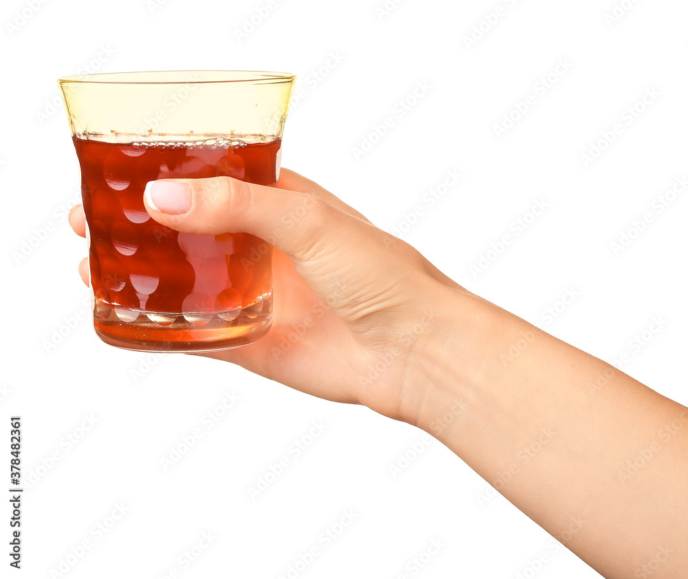 Hand with glass of fresh juice on white background Hand with glass of fresh juice on white background