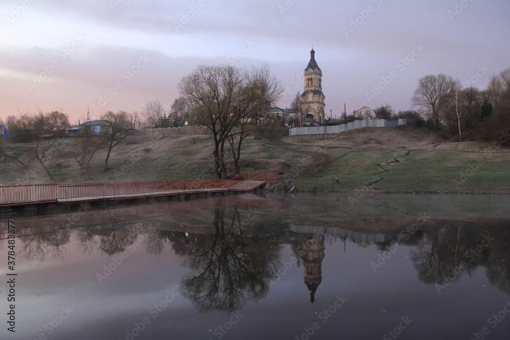 Russian orthodox church on the river in an early morning