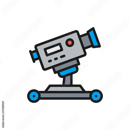 Digital cinema camera on wheels flat color line icon.