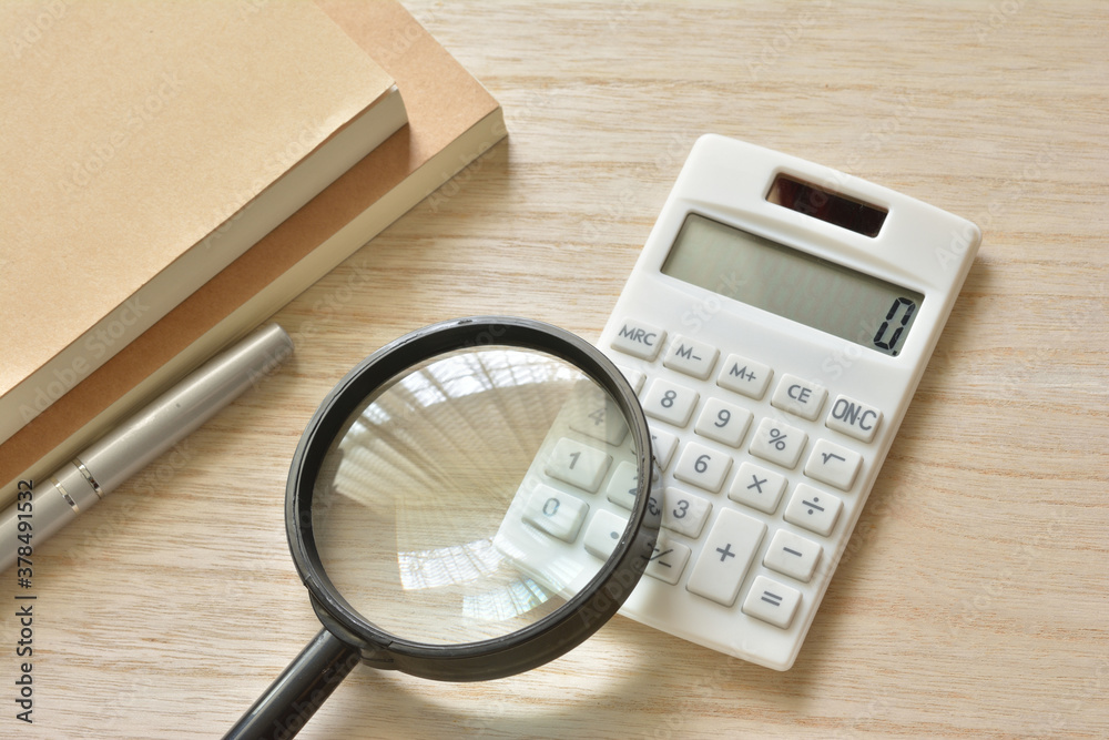 Magnifying glass and calculator