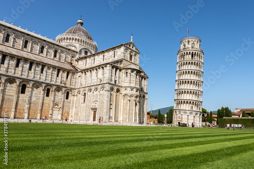 Pisa, the Leaning Tower and the Cathedral (Duomo di Santa Maria Assunta) in Romanesque style, Square of Miracles (Piazza dei Miracoli). Tuscany, Italy, Europe