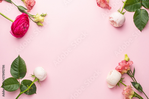 Pink and white flower bouquet on pink background with copyspace