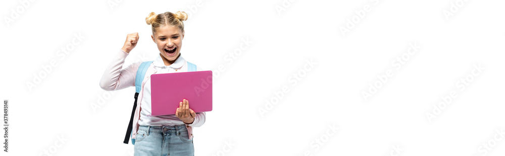 Horizontal crop of excited kid showing yeah while holding laptop isolated on white Horizontal crop of excited kid showing yeah while holding laptop isolated on white