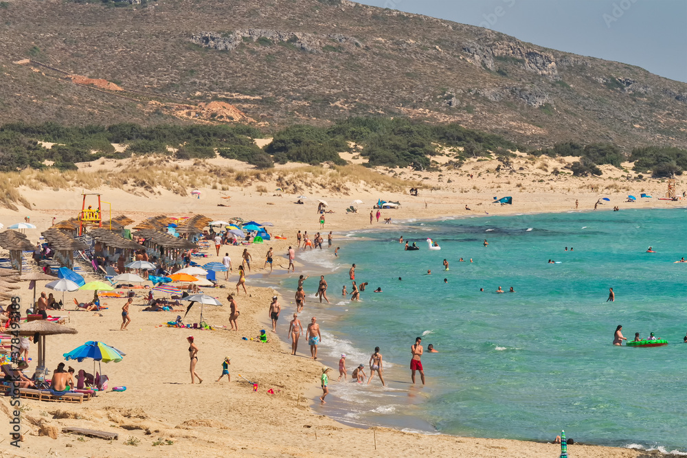People enjoying their summer holidays at Simos beach in Elafonisos in Greece.
