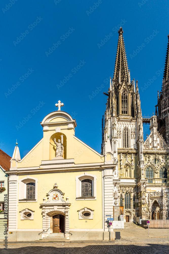 Obraz premium View at the Church of St.Johann with Cathedral tower in Regensburg - Germany