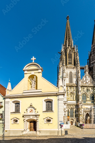 View at the Church of St.Johann with Cathedral tower in Regensburg - Germany