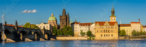 Famous Charles Bridge In Prague on a beautiful summer afternoon