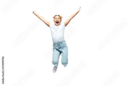 Excited schoolgirl jumping isolated on white background, one person 