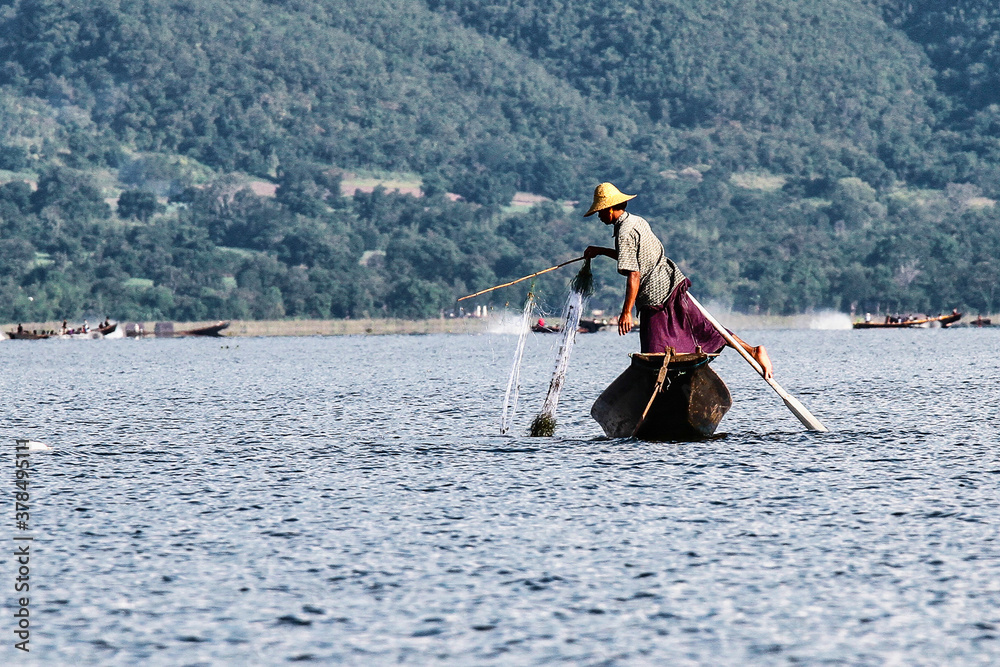 Naklejka premium Traditional one Leg Fisher on Inle Lake in Mayanmar, former Burma