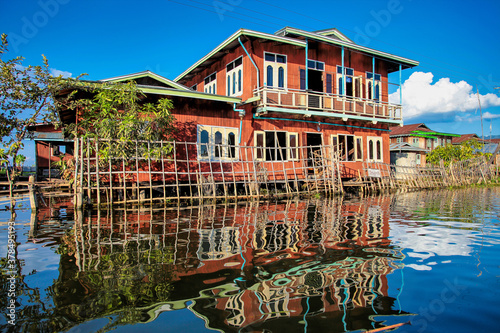 Fototapeta Naklejka Na Ścianę i Meble -  Wooden floating houses on Inle Lake in Shan, Myanmar, former Burma