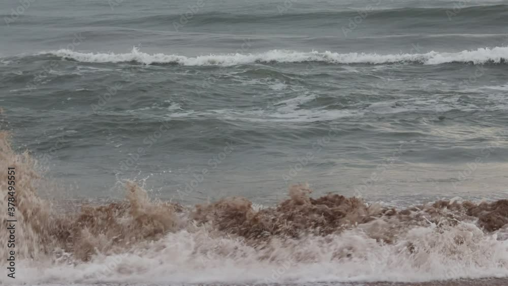 Due to bad weather, the sea is raising huge waves of water, The sea view before sunrise in the morning on the Ocean coast of India, without editing and colour correction , Natural Due to bad weather, the sea is raising huge waves of water, The sea view before sunrise in the morning on the Ocean coast of India, without editing and colour correction , Natural