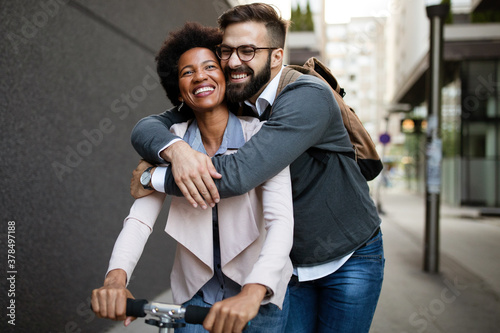 Happy loving couple. Happy young man and woman having fun together in city