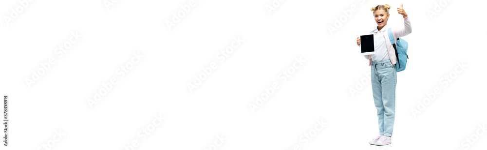 Panoramic shot of schoolgirl showing thumb up while holding digital tablet on white background Panoramic shot of schoolgirl showing thumb up while holding digital tablet on white background