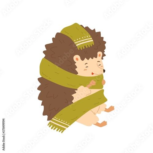 Cute colorful hedgehog wrapping in warm cozy scarf vector flat illustration. Adorable forest animal warming sitting isolated on white. Joyful wild childish character enjoying autumn season