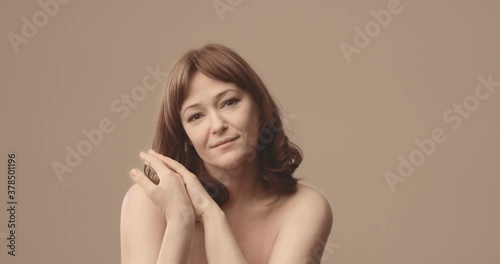 Happy , smiling middle aged woman Brown-haired. Natural. Nude. High quality 4k footage