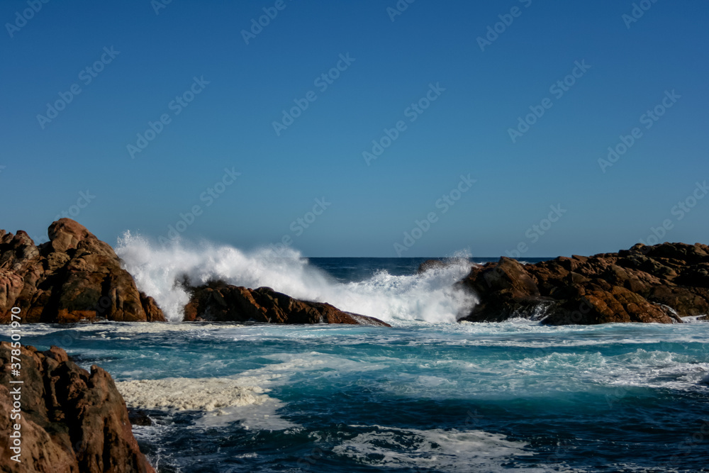 waves crashing on rocks at Canal Rocks, Western Australia