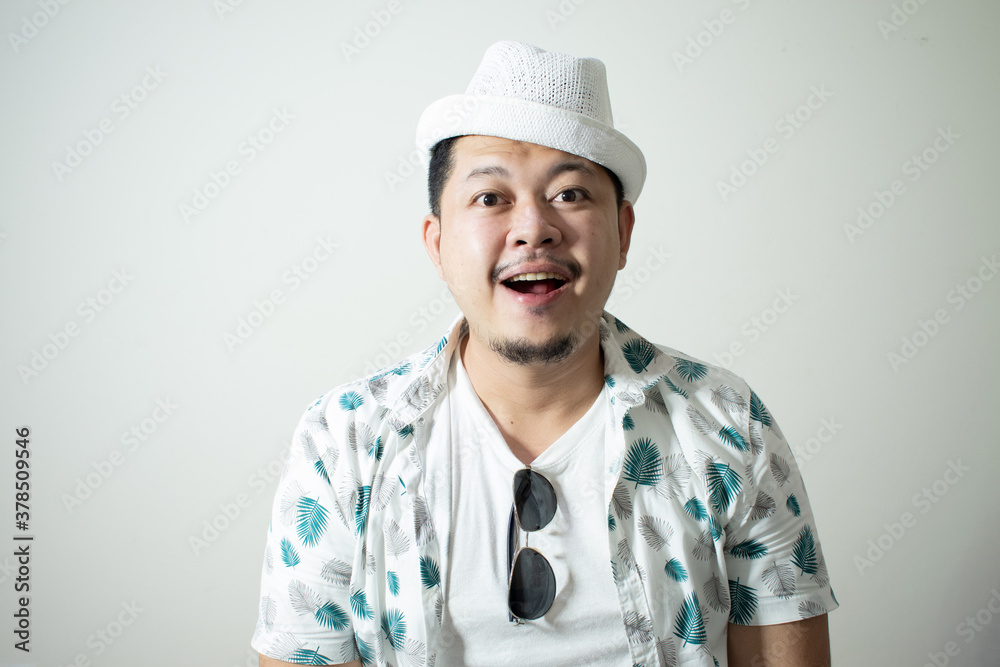 Studio shot of happy tourist man smiling while wearing hat and sunglasses
In a white background.
Holiday traveler concept Studio shot of happy tourist man smiling while wearing hat and sunglasses
In a white background.
Holiday traveler concept
