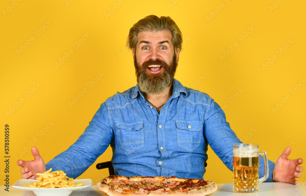 man watching football while drinking beer with pizza and french fries. eating pizza and drink. Best party here. bachelor men club. Having fun and drink in bar. american pub menu man watching football while drinking beer with pizza and french fries. eating pizza and drink. Best party here. bachelor men club. Having fun and drink in bar. american pub menu