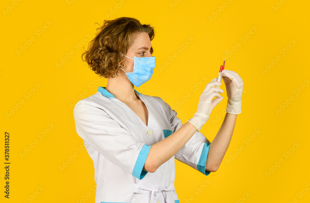Doctor with syringe is preparing for injection. injection against coronavirus. virus epidemic outbreak. immunity vaccination. nurse wear respirator mask. Physician giving vaccine. HPV concept Doctor with syringe is preparing for injection. injection against coronavirus. virus epidemic outbreak. immunity vaccination. nurse wear respirator mask. Physician giving vaccine. HPV concept