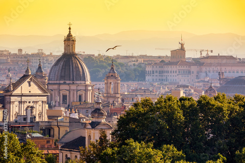 Cityscape view of historic center of Rome, Italy from the Gianicolo hill during summer sunny day sunset