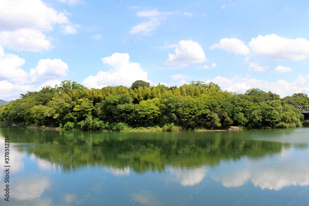 Green Okayama Korakuen Garden and its reflection