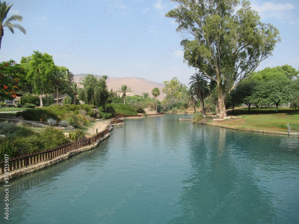 Gorgeous blue Tel Amar river in Nir David, Israel with Gilboa Mountains seen in the background Gorgeous blue Tel Amar river in Nir David, Israel with Gilboa Mountains seen in the background