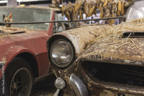 Barcelona  Spain  April 3  2018  Old car abandoned full of straw and dust in the barn. 1400 a Sport