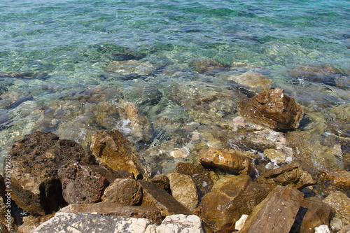 sea coastline with rocks and transparent water