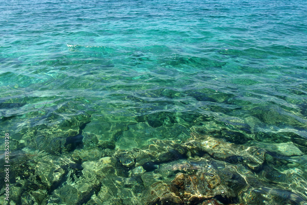 calm transparent turquoise sea surface