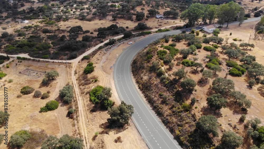 Aerial images over an area of Mediterranean forest. Flying following a local road Aerial images over an area of Mediterranean forest. Flying following a local road