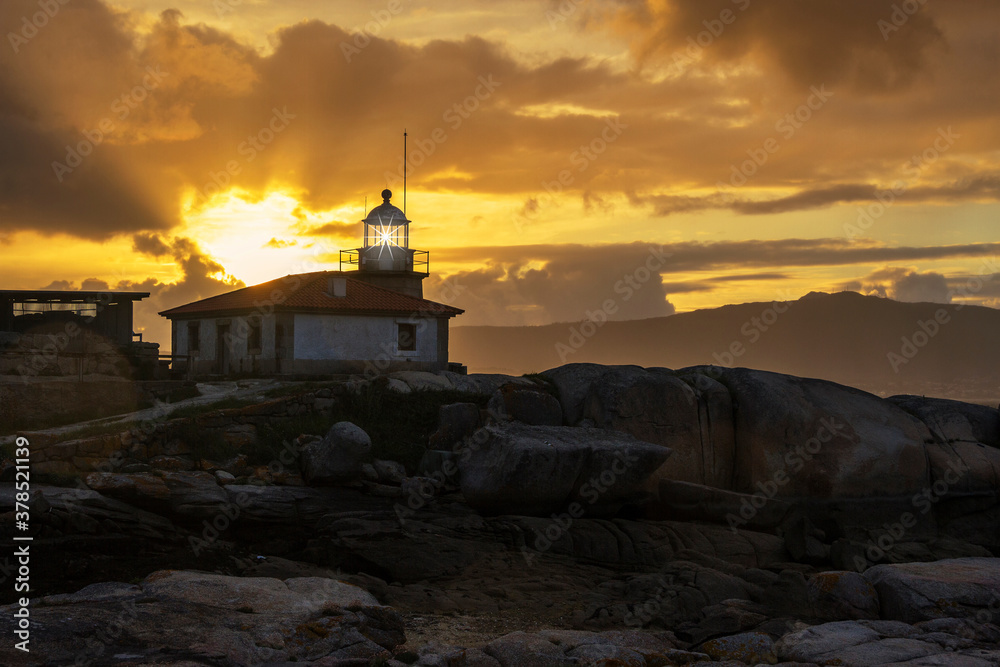 Lighting lighthouse at sunset