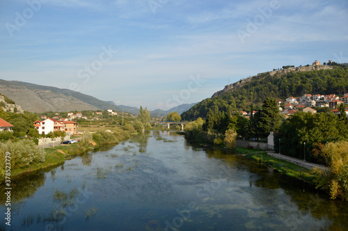 view of Trebinje town on the banks of river Trebisnjica, Bosnia and Herzegovina © Jana