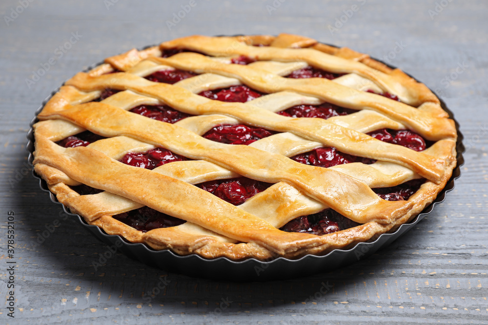 Delicious fresh cherry pie on light grey wooden table, closeup Delicious fresh cherry pie on light grey wooden table, closeup