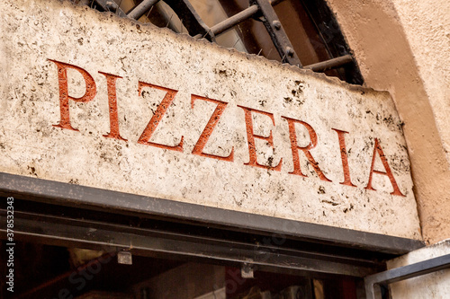Canvas Print Old retro pizzeria signboard in Rome, Italy