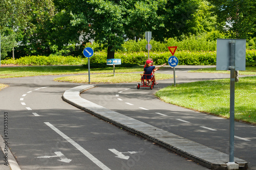 Traffic educational experience - practice park for children. Mini car road, traffic sign and traffic light