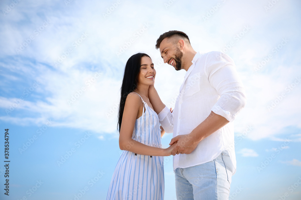 Happy young couple on sunny day. Beach holiday Happy young couple on sunny day. Beach holiday