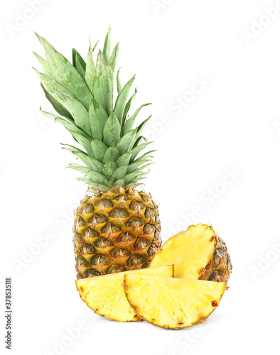 Whole and cut juicy pineapples isolated on white