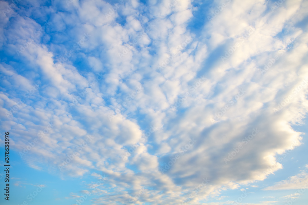 Cirrocumulus clouds in long rows high in the sky Cirrocumulus clouds in long rows high in the sky