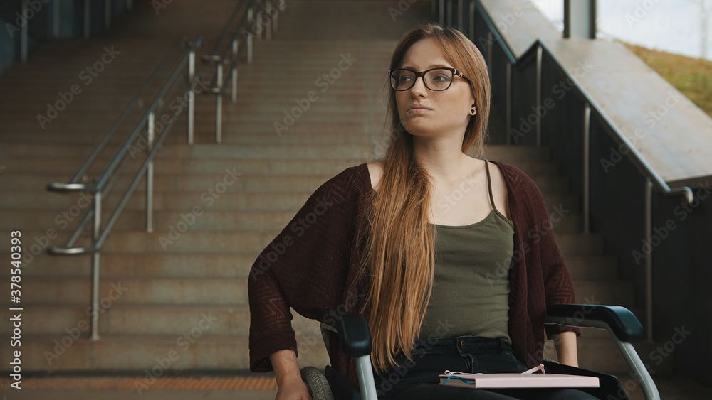 Εκτύπωση καμβά Sad helpless disabled young woman in front of the stairways in the wheelchair