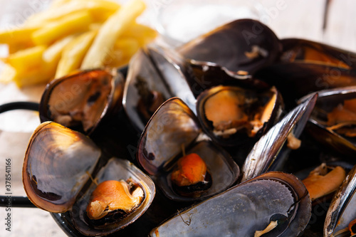 Moussels and french fries or molues-frites.Close up photo