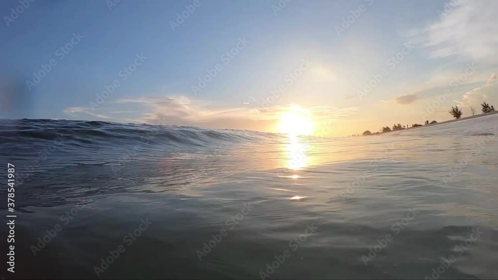 Slowmotion wave crash at sunset Slowmotion wave crash at sunset