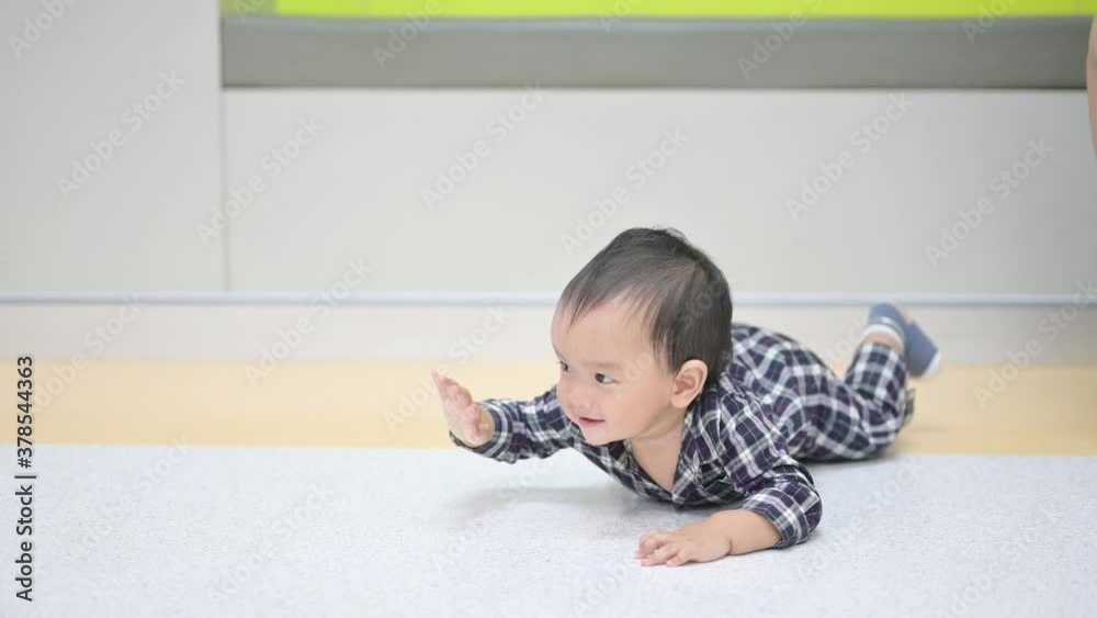 Crawling asian baby boy at home on floor Crawling asian baby boy at home on floor