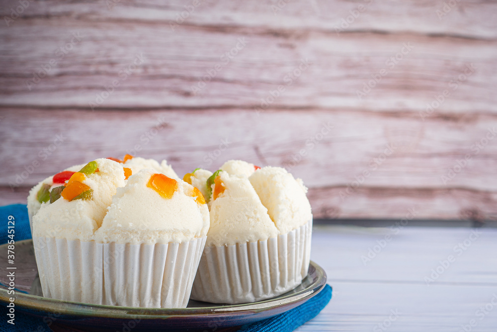 Thai Rice flour muffin topped with dry fruit on plate Thai Rice flour muffin topped with dry fruit on plate