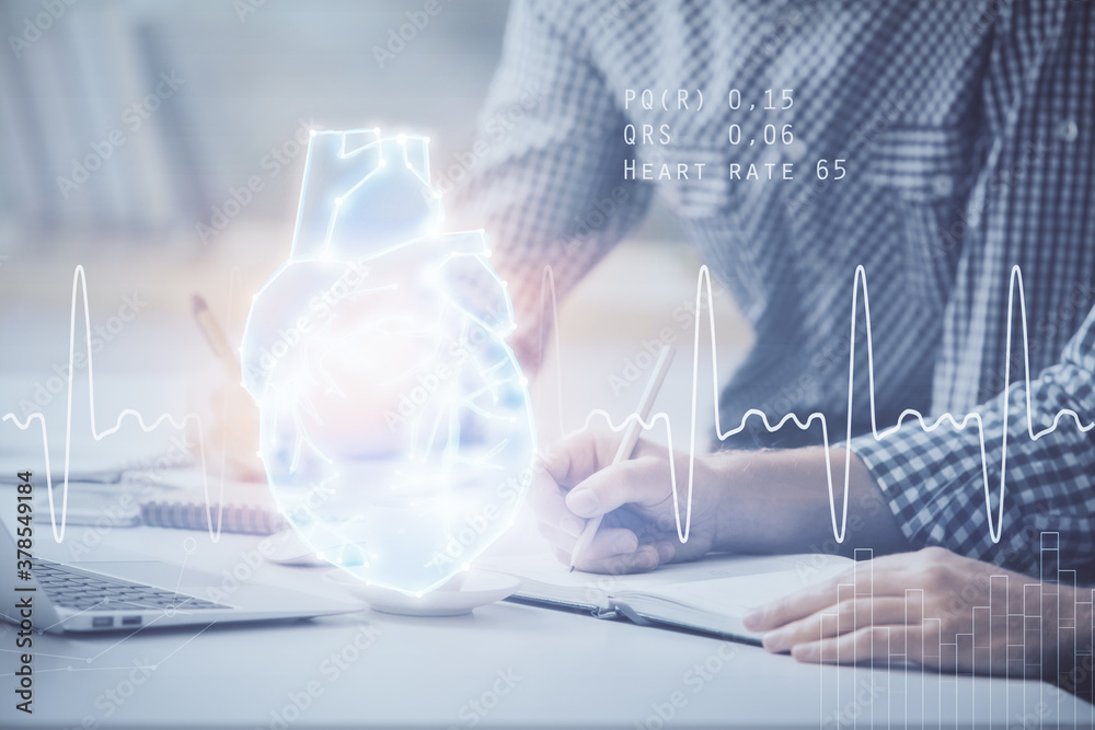 Heart drawing with man working on computer on background. Medical concept. Double exposure. Heart drawing with man working on computer on background. Medical concept. Double exposure.